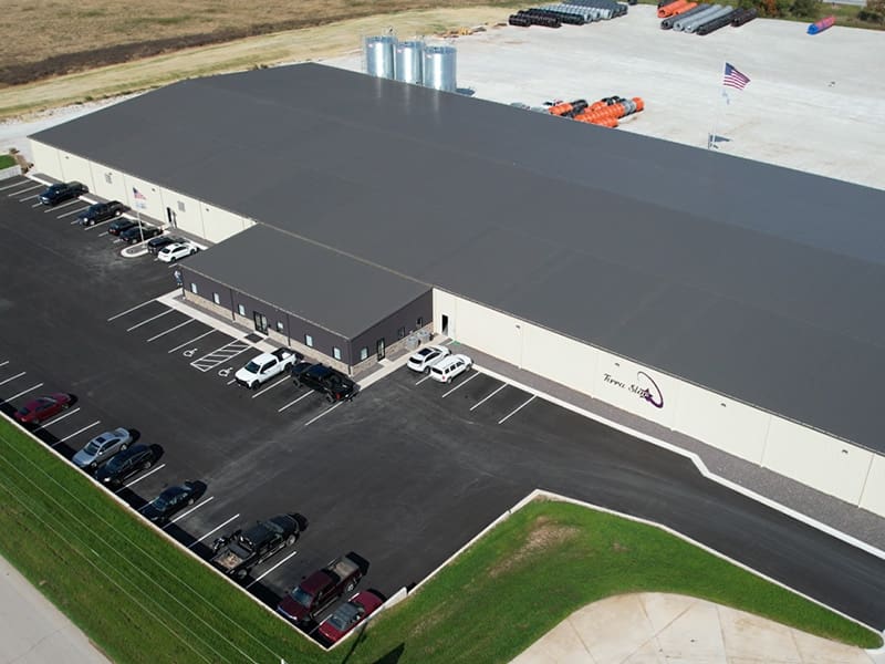 Aerial view of Terra Star's HDPE conduit manufacturing facility in Rogersville, Missouri, highlighting the large production building and surrounding area.