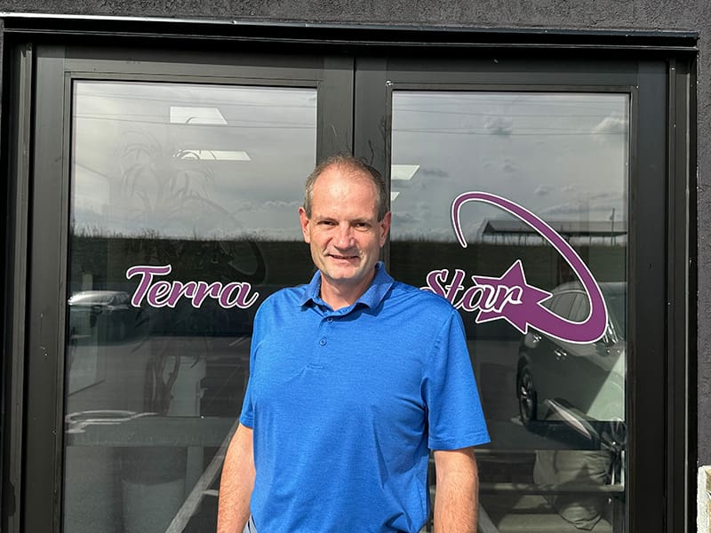 Juergen Windbacher, Director of Reporting and Operational Excellence at Terra Star, standing in front of the company’s main entrance.